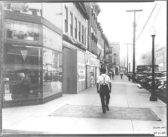 #31: on sidewalk of e wash ave, looking west