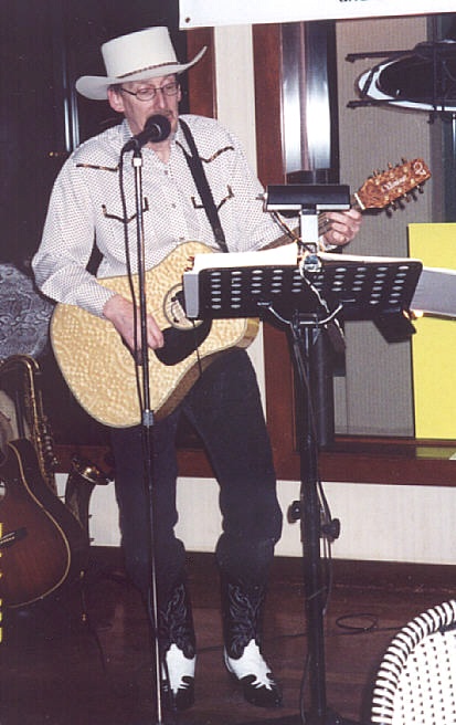tommy's playin'-the-guitar stance